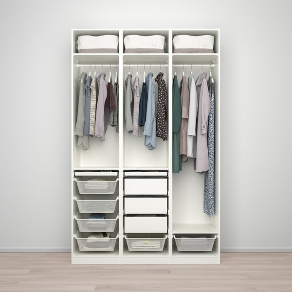 Organised wardrobe with hanging clothes, shelves, and storage baskets.
