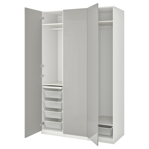 White PAX wardrobe with shelves, drawers, baskets, and rails.