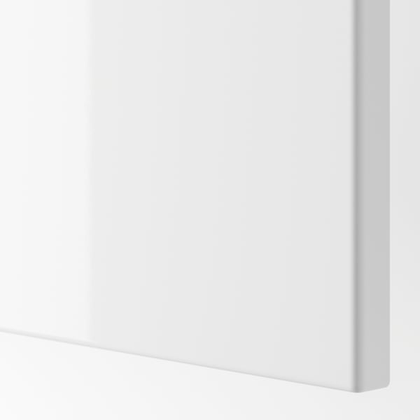 Modern white cabinet with sleek edges. Soft-closing hinge detail visible, ensuring smooth operation.