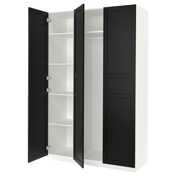 A white and black PAX wardrobe with open doors, revealing shelves inside.