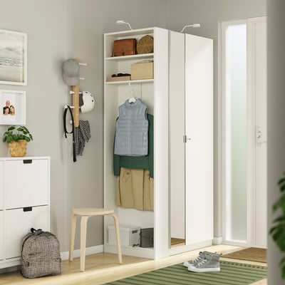 White PAX wardrobe with mirror, stool, and accessories.