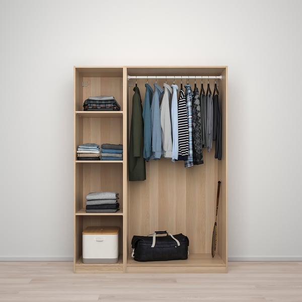 Wooden wardrobe with hanging shirts, folded clothes, and storage bins. Adjustable feet, and includes clothes rail.
