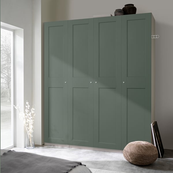 Large green PAX wardrobe with 4 panels, a vase, and a pillow.