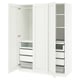 A white ikea PAX wardrobe with open drawers and shelves.