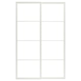 An empty white PAX wardrobe frame for sliding doors.