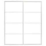 This image shows a white PAX wardrobe frame with a sliding door setup, featuring a sleek, modern design with metal construction.