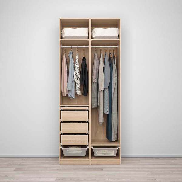 Wooden wardrobe organizes clothes and storage with drawers, shelves, and hangers.