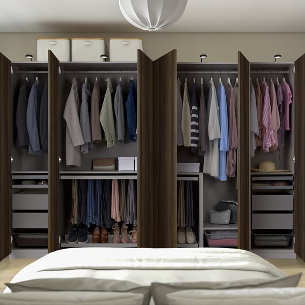 Open wardrobe with clothes, shelves, and storage boxes. Adjusts to floor and uses dampers for slow door close.