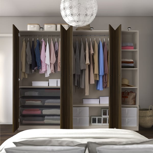 Wardrobe with shelves, hanging space, adjustable feet, trays, and light.