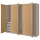 An open light brown PAX wardrobe with shelves and drawers.