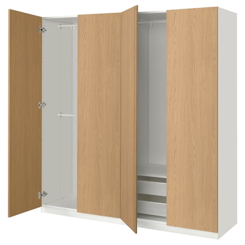 An ikea PAX wardrobe in white and natural oak with both doors open, revealing adjustable shelves and mesh drawers.