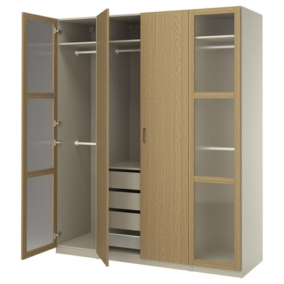 PAX wardrobe, oak, doors open showing shelves, hangers, & drawers. Soft-close hinges.