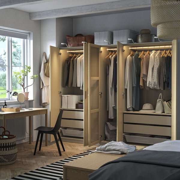 Modern wardrobe with clothes, bags, and hats. Soft-closing doors, adjustable interiors, and built-in lighting.