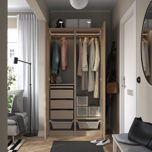 Open wardrobe showcasing coats, drawers, and storage boxes; slow-closing hinges and adjustable feet.