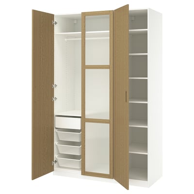 Modern white PAX wardrobe with oak doors open, showing shelves and organizers.