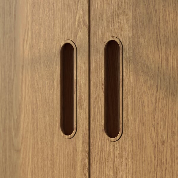 Wooden wardrobe with folded handles, light brown finish, double doors.