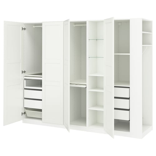 White PAX wardrobe with open drawers and shelves, sleek design.