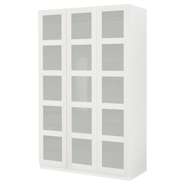 Displays a white ikea PAX wardrobe with frosted glass doors. The design three sections with adjustable interiors.