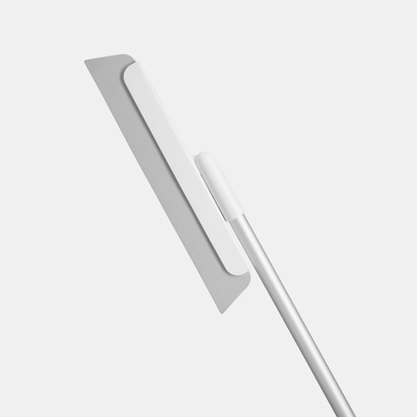 Silver squeegee, gentle floor cleaning tool.