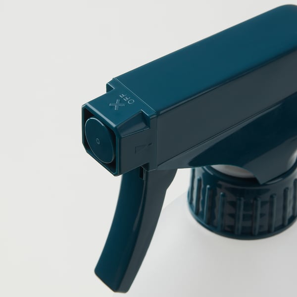 Dark blue spray bottle with adjustable nozzle and lock.