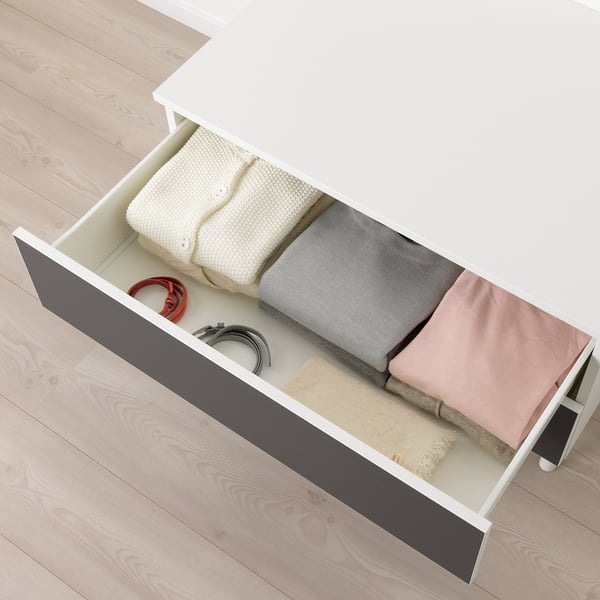 Open PLATSA drawer showing neatly folded blankets and towels.