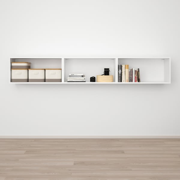 Modern wall-mounted shelf with storage boxes and books.