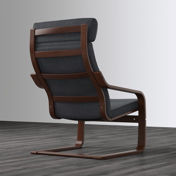 Dark grey upholstered chair with wooden frame, curved lines for neck support, and angled seat for comfort.