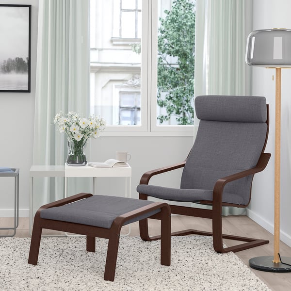 Modern living room with POÄNG chair, ottoman, ornaments, and lamp.