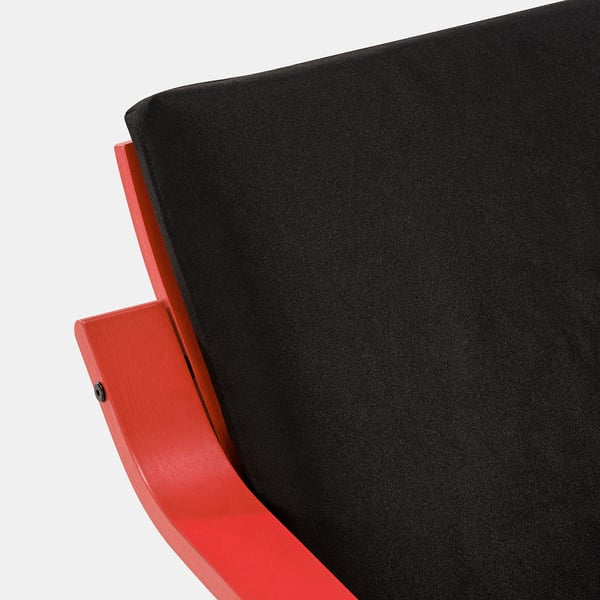 Modern red armchair, sectional detail. Smooth black fabric on curved wooden frame.