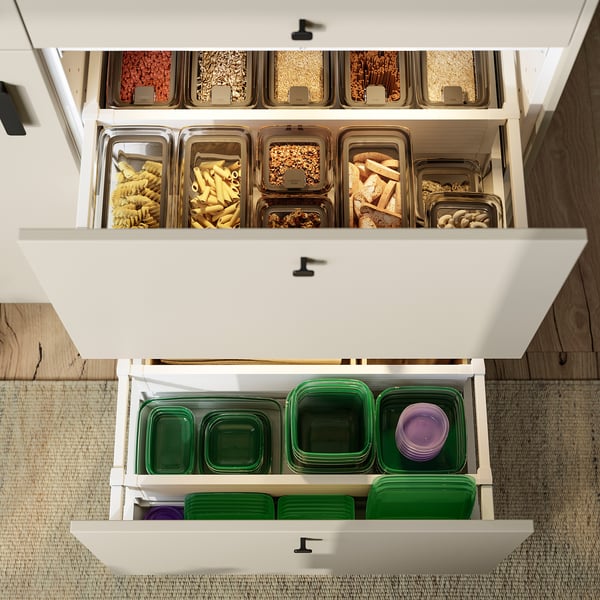 Kitchen cabinet with PRUTA containers, pasta, nuts, seeds; stackable.