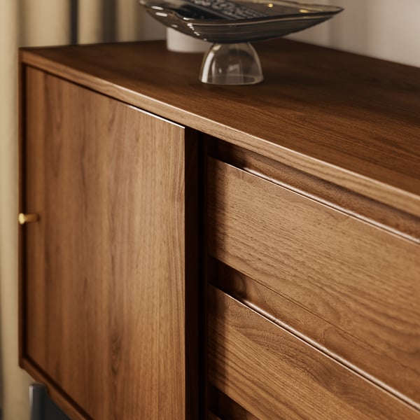 A sleek, mid-century styled wooden tv stand with warm walnut tones, showcasing excellent craftsmanship and quality materials.