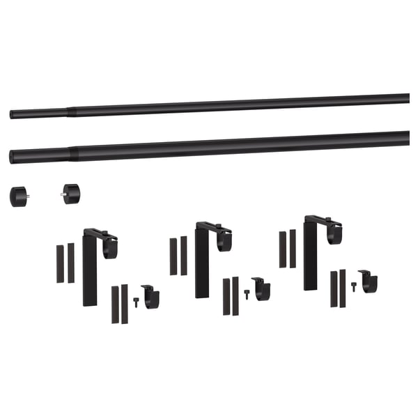 Black RÄCKA curtain rod set, including parts and holders, laid out neatly.