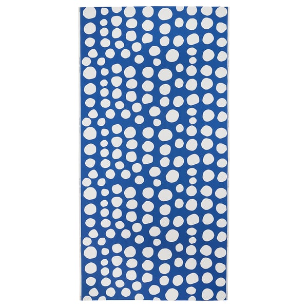 A blue fabric with white polka dots, perfect for crafting or sewing.