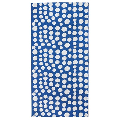 A blue fabric with white polka dots, perfect for crafting or sewing.