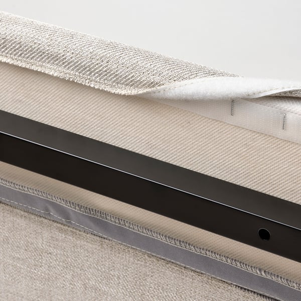 Close-up of RAMNEFJÄLL bed cover; machine washable, easy to remove and put back on.