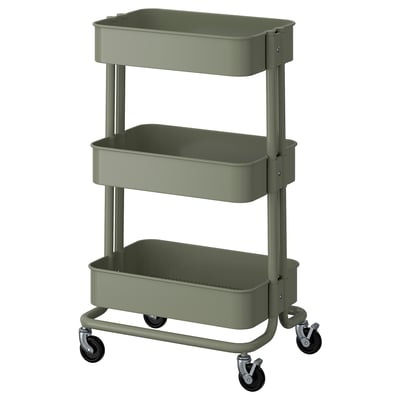 Green 3-tier utility cart, ikea RÅSKOG, with metal shelves and wheels, perfect for storage.