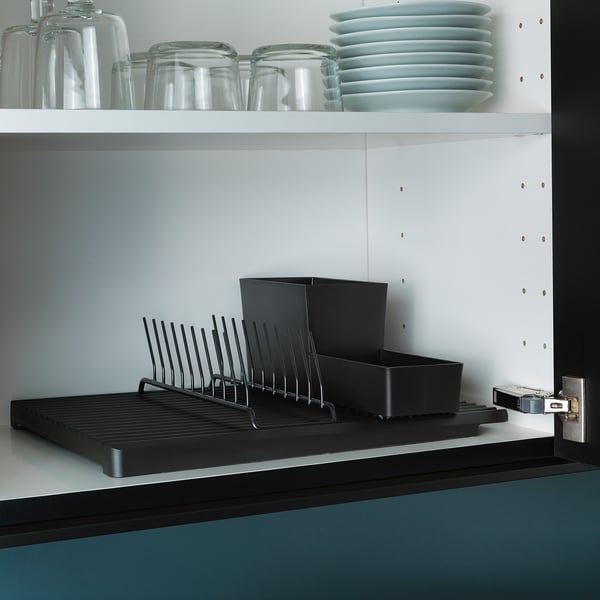 Black dish drying rack with compartments, fits 9 plates, sits on counter.
