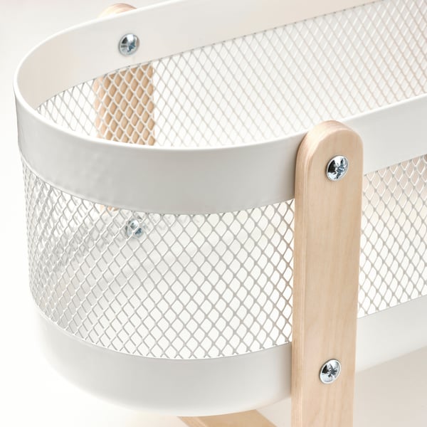Modern, stylish metal basket with wooden handles for organising items.