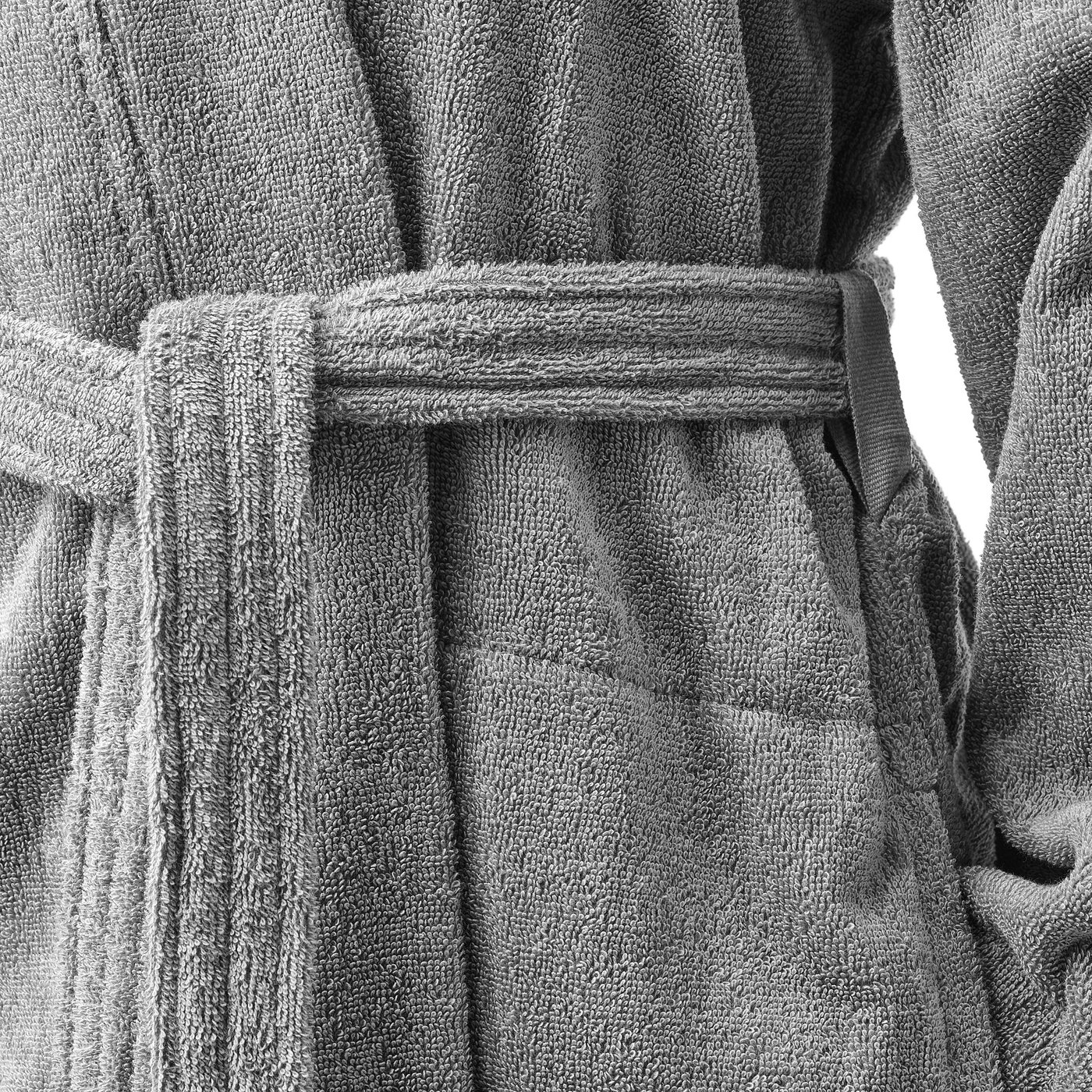 Fine, plush cotton bathrobe, detailed with adjustable belt loop, side pockets, and diagonal sleeve seams for comfort.