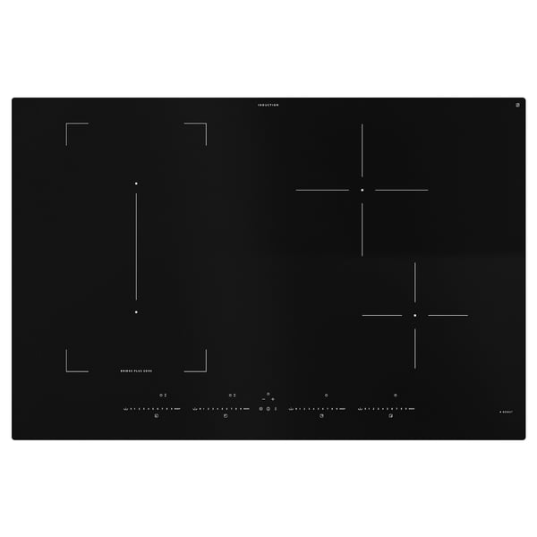 Black induction hob with four heating zones, touch controls, and bridge function for odd-size pots.