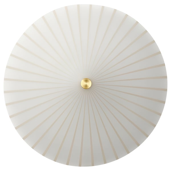 Round white lamp with gold centre, radial pattern.