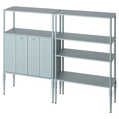 Displays a grey SÅGMÄSTARE metal cabinet and shelving unit with rounded corners and turned legs, offering both open and closed storage.