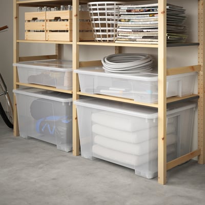 Wooden shelves with clear plastic storage boxes, some filled with papers and others with rolled items. Boxes have locking lids for secure storage.