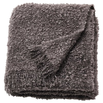 A grey, rectangular SANDBRODD throw blanket with a crinkled texture and fringe ends, made from 100% recycled polyester.