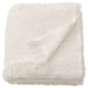 White SANDBRODD blanket, soft, textured, folded, fringed.