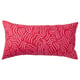 A red rectangular SANDMOTT cushion with pink abstract patterns. It a scandinavian design, made with 100% cotton and mixed fibre filling.