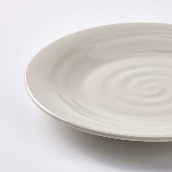 Simple white plate with textured, rustic surface. Clean, smooth edge.