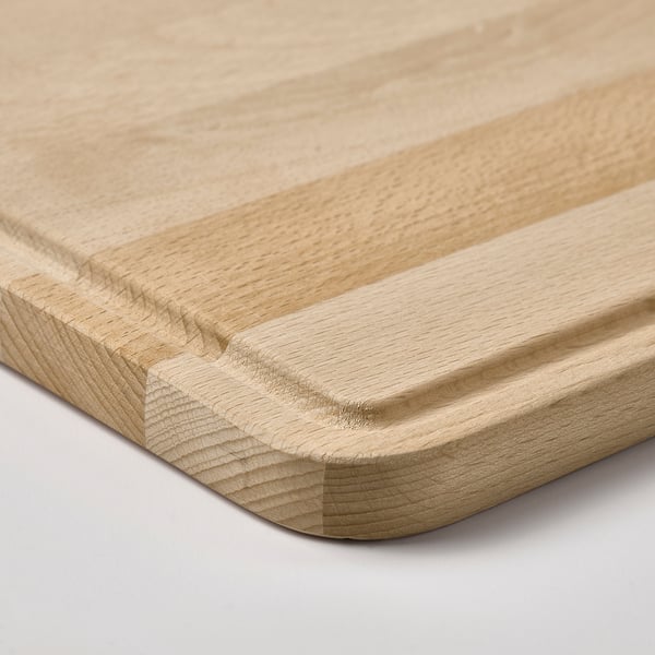 Wooden chopping board with smooth surface and rounded edges. Natural beech finish. Juice groove for clean cutting.