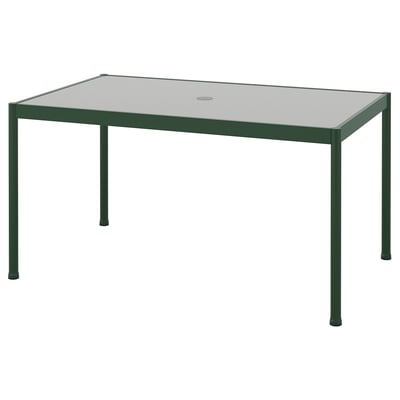 Green outdoor table with glass top, rectangular shape.