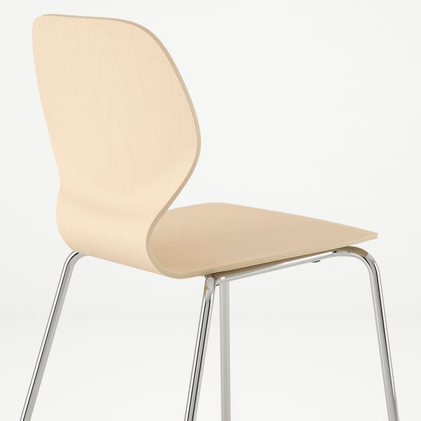 Modern chair with sleek curved seat and metal legs, designed for comfort and support.